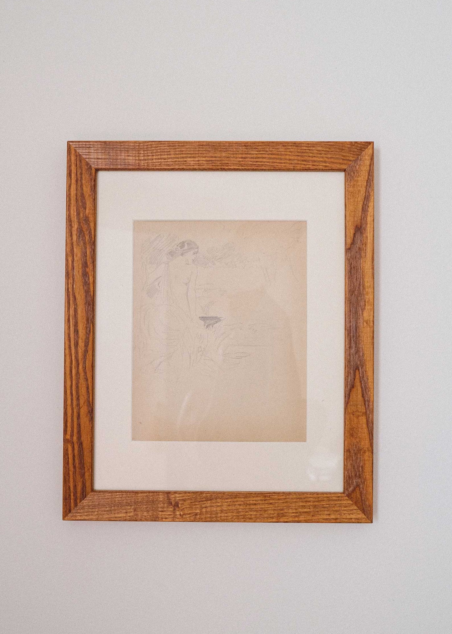 Framed artwork on a plain wall