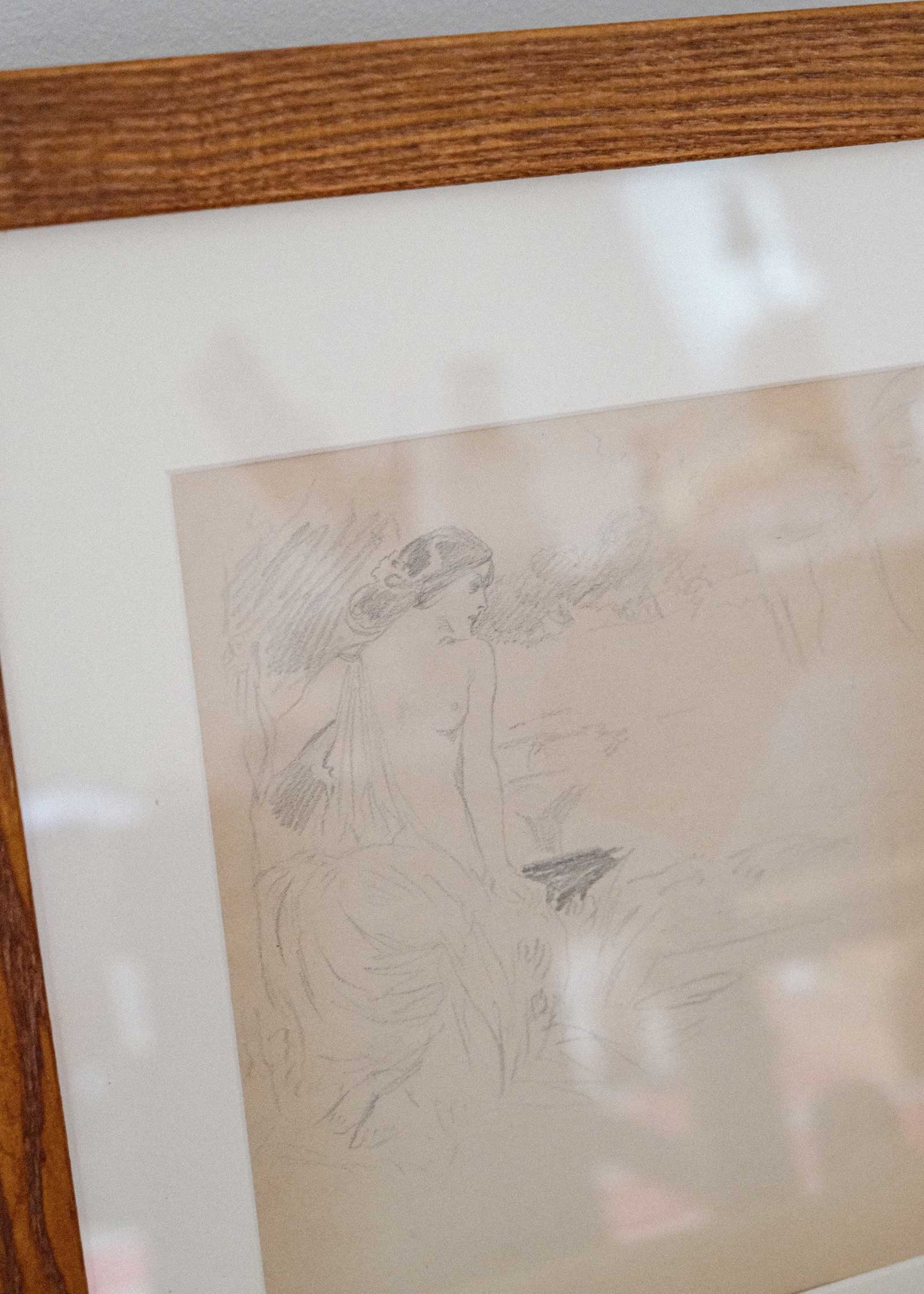 Framed artwork with a wooden border on a white background
