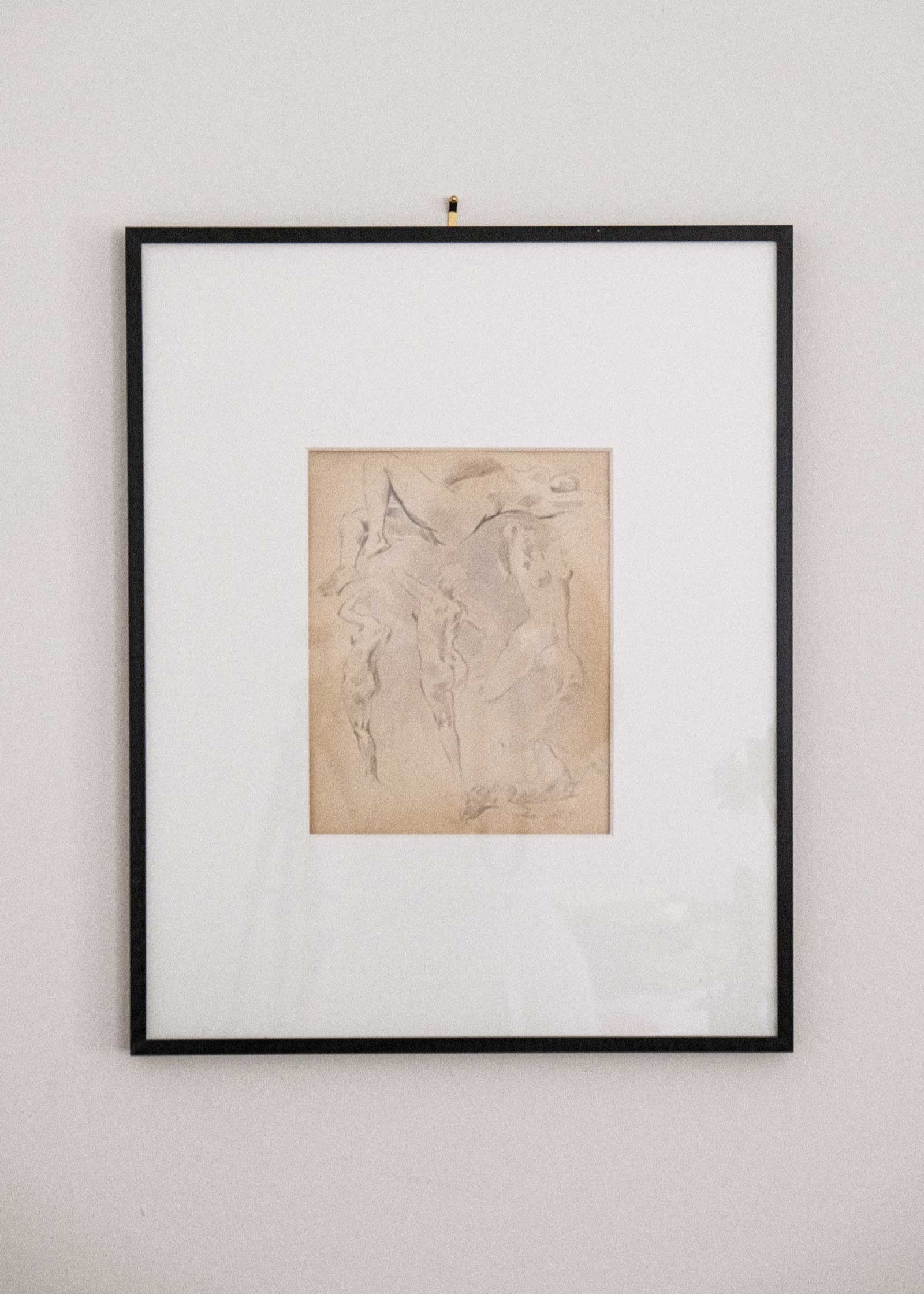 Framed artwork on a plain wall