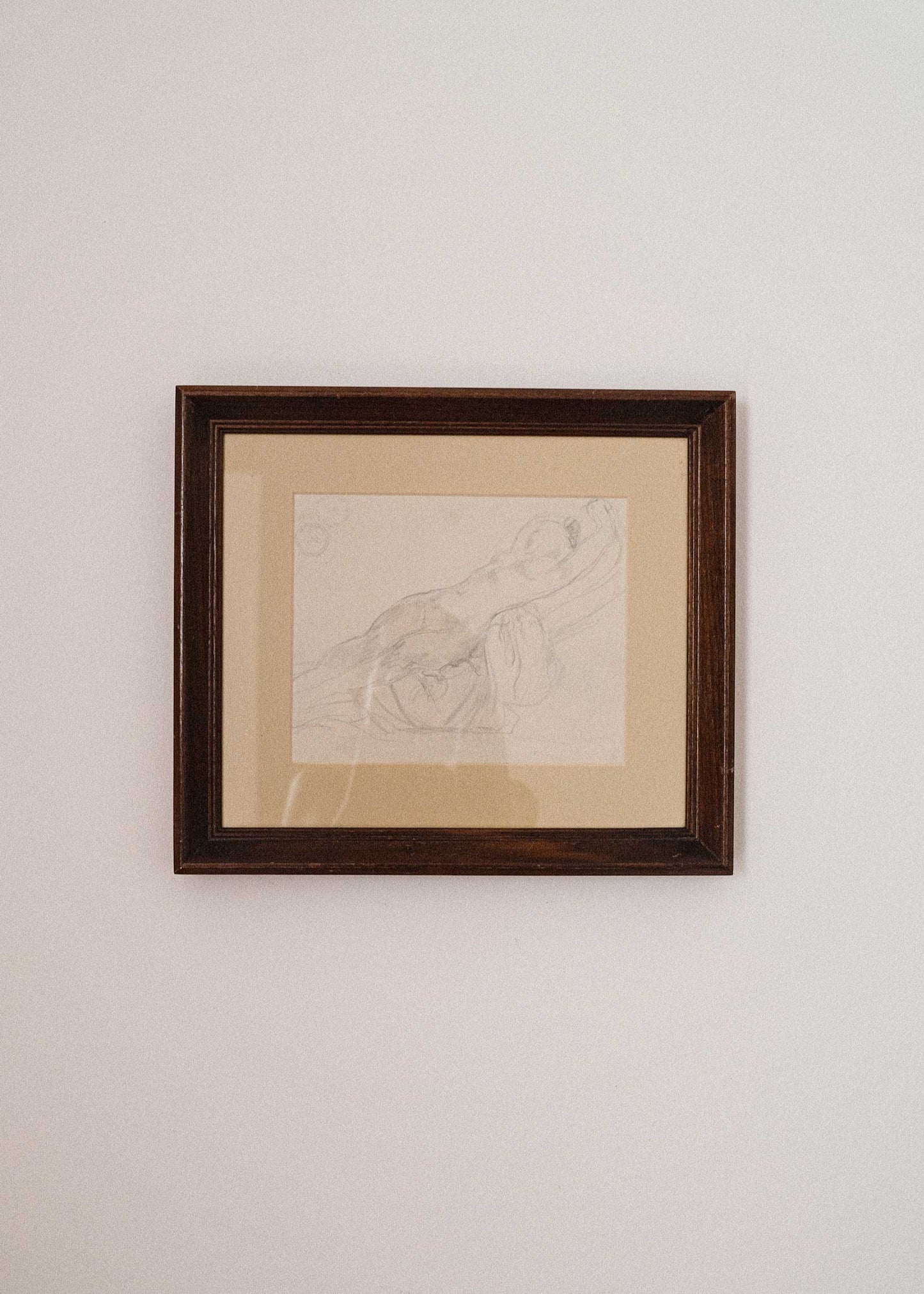 Framed artwork on a plain wall