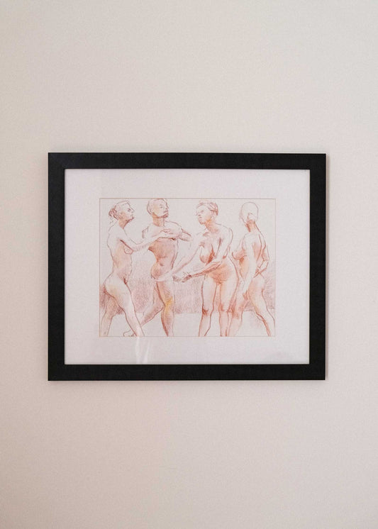 Framed artwork of three nude figures on a beige wall