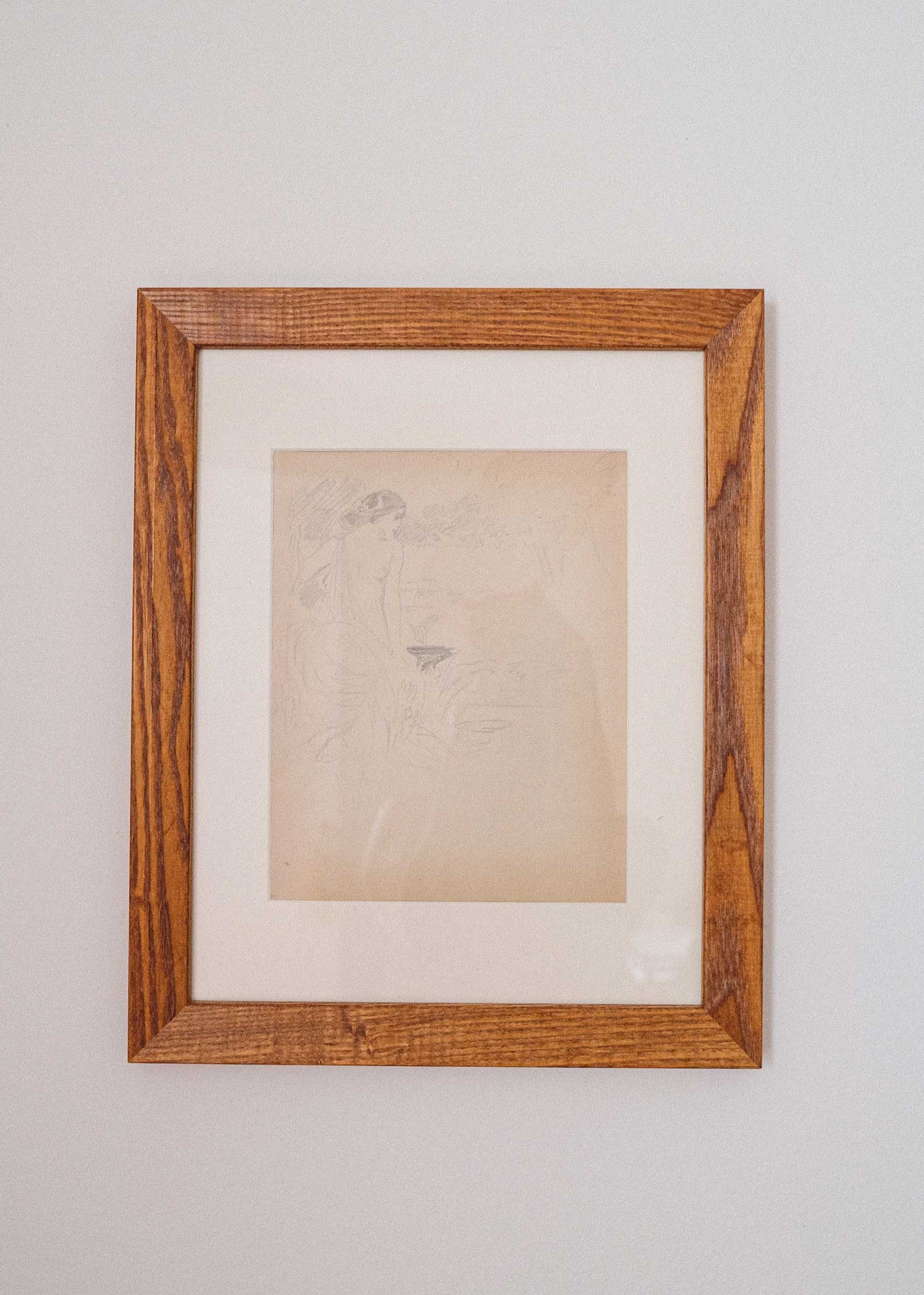 Framed artwork on a plain wall