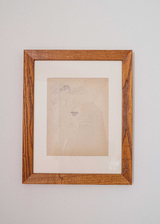 Framed artwork on a plain wall