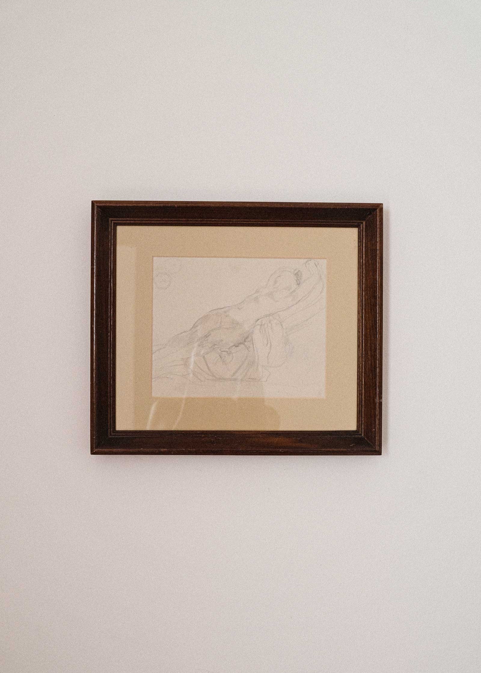 Framed artwork on a plain wall