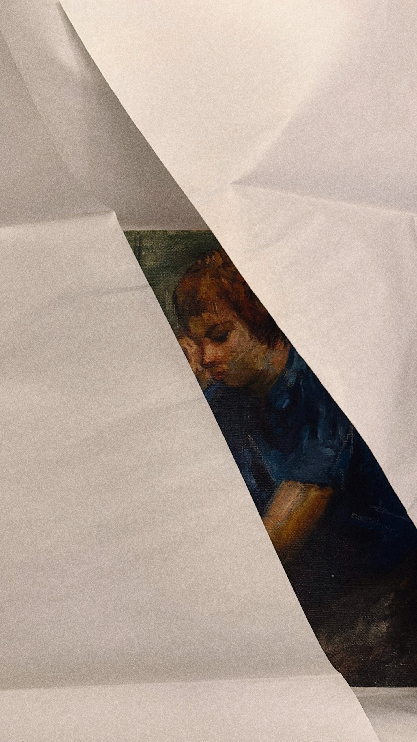 Partial view of an art piece through crumpled paper