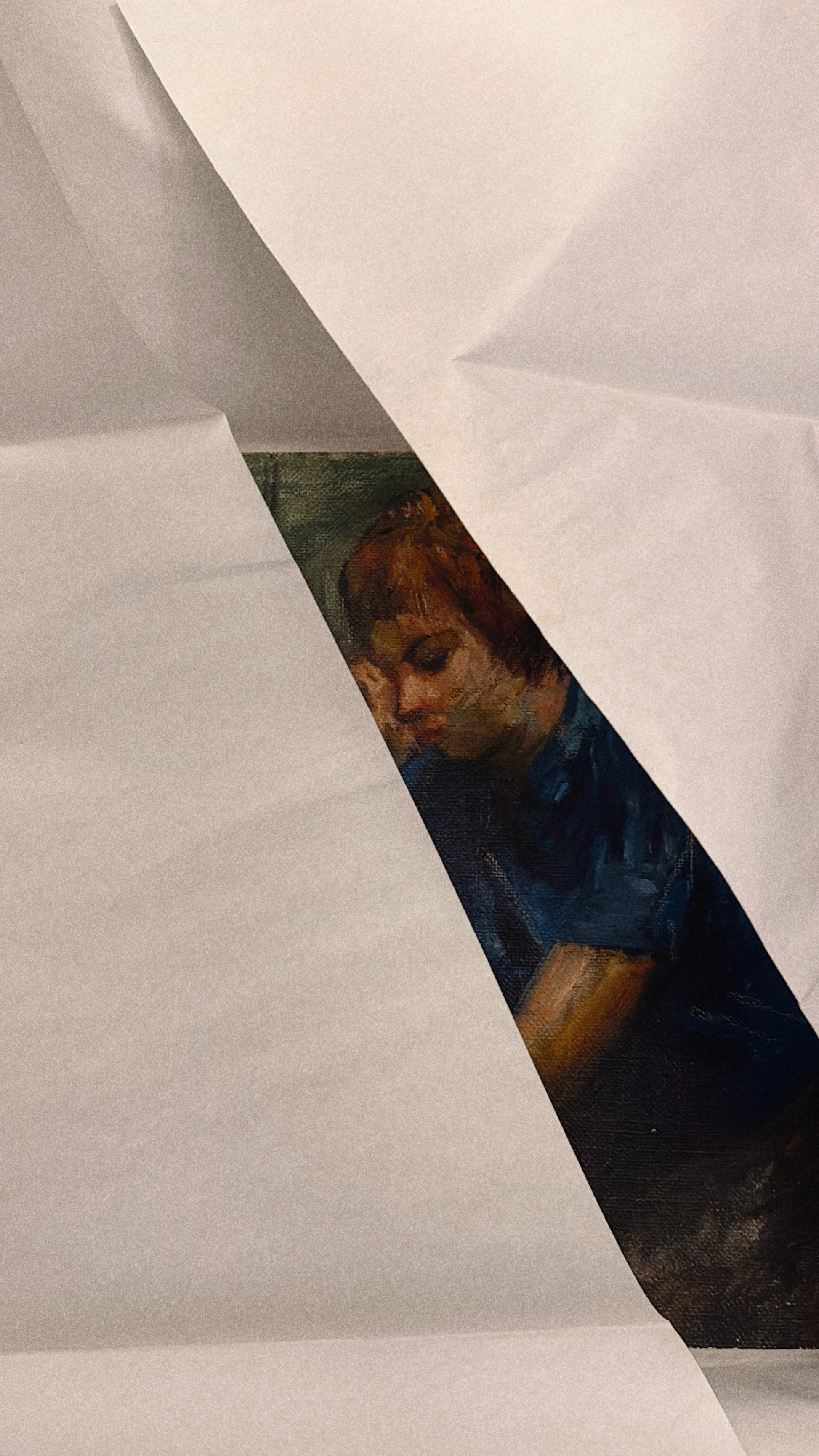 Partial view of an art piece through crumpled paper
